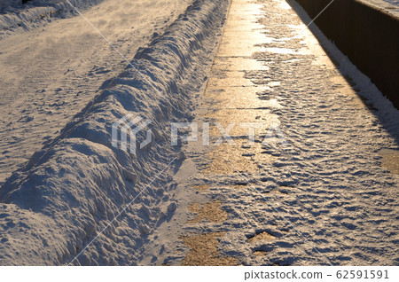 Granite pavement in St. Petersburg at winter. Granite pavement in St. Petersburg at winter. 62591591