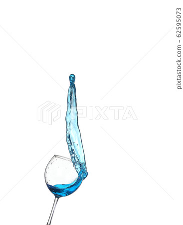 Blue alcoholic cocktail on white isolate splash 62595073