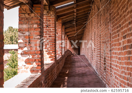 The red brick wall of the old Kremlin military The red brick wall of the old Kremlin military 62595716