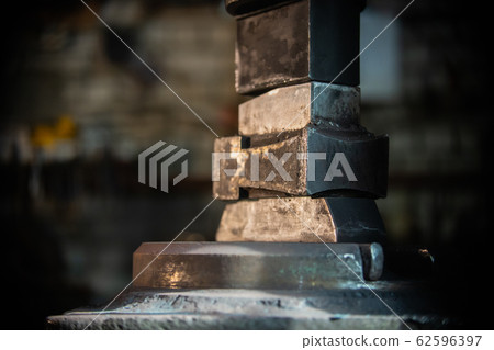 Blacksmith equipment for forging a detail out of the hot metal Blacksmith equipment for forging a detail out of the hot metal 62596397