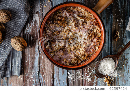 Baked granola with nuts and coconut Baked granola with nuts and coconut 62597424