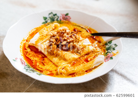 Serving of curry chee cheong fun, popular breakfast in Malaysia among ethnic Chinese. Serving of curry chee cheong fun, popular breakfast in Malaysia among ethnic Chinese. 62599601