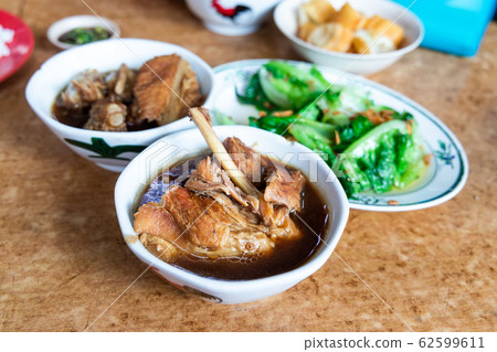 Serving of bak kut teh with vegetable, popular meal in Klang, Malaysia as breakfast or lunch. 62599611