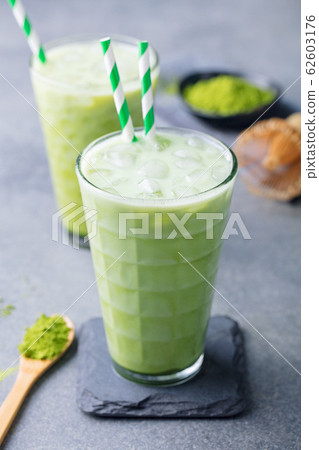 Matcha iced green tea. Grey background. Close up. Matcha iced green tea. Grey background. Close up. 62603176