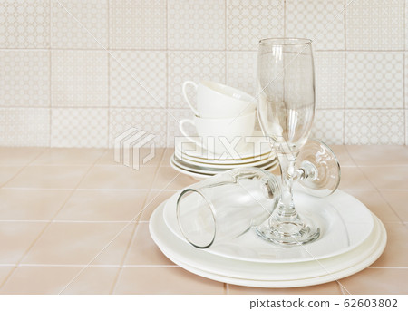 Clean dishes on the kitchen table 62603802