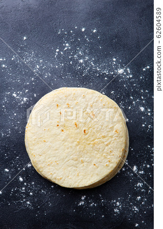 Tortillas, flat breads on dark grey background. Copy space. Top view. 62604589