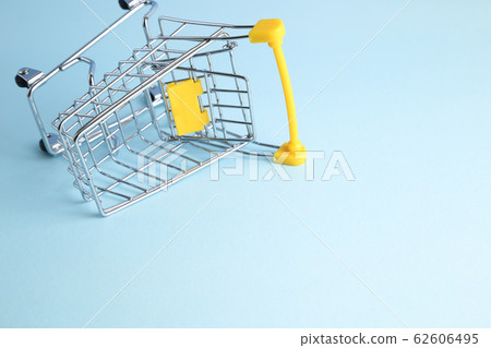 Shopping cart on blue background. Business concept 62606495