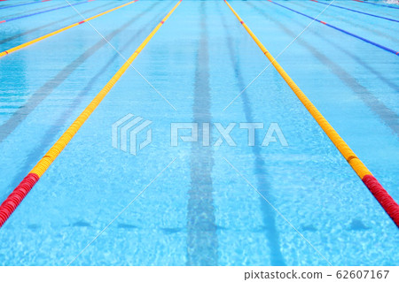 Empty swimming pool with competition lanes for background. 62607167
