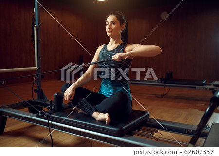 Slim woman in sportswear, pilates training 62607337