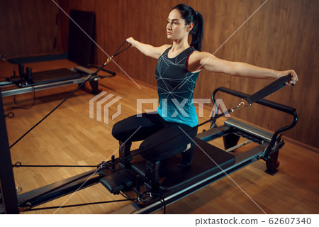 Sporty woman in sportswear, pilates training Sporty woman in sportswear, pilates training 62607340