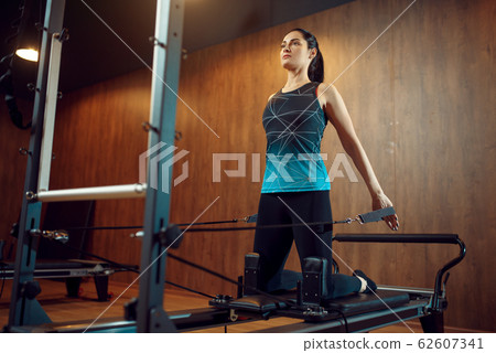 Slim woman in sportswear, pilates training 62607341