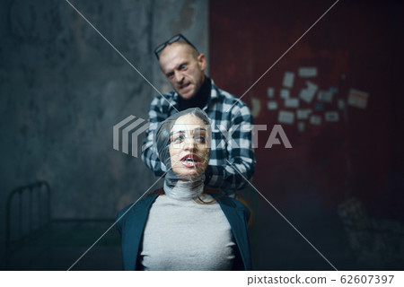 Maniac kidnapper smothers his scared female victim Maniac kidnapper smothers his scared female victim 62607397