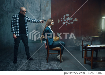 Maniac kidnapper puts a gun to his victim's head 62607402