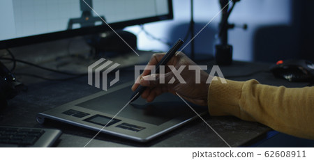 Digital artist using a graphics tablet 62608911