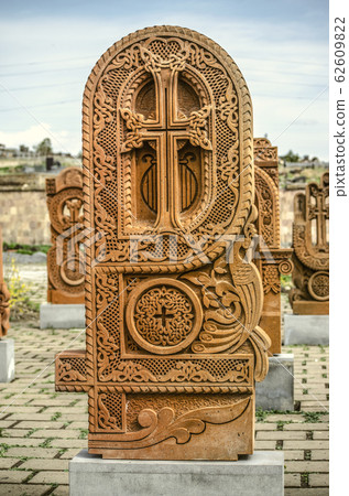 Stone cross carved with ornaments in the form of the thirty-sixth  letter  of the Armenian alphabet, created by Mesrop Mashtots in the village of Oshakan 62609822