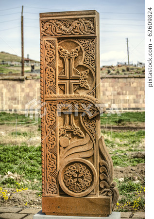 Stone cross carved with ornaments in the form of the thirty-fourth  letter     of the Armenian alphabet, created by Mesrop Mashtots in the village of Oshakan 62609824