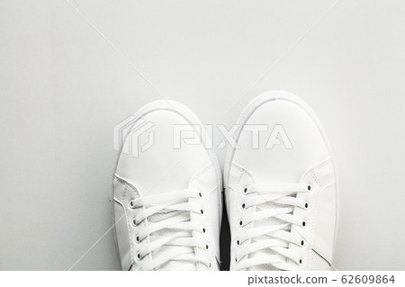 Stylish white fashion sneakers on white background. 62609864