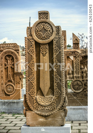 Stone cross carved with ornaments in the form of the twenty-ninth  letter  of the Armenian alphabet, created by Mesrop Mashtots in the village of Oshakan 62610043