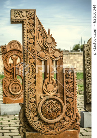 Stone cross carved with ornaments in the form of the twenty second  letter  of the Armenian alphabet, created by Mesrop Mashtots in the village of Oshakan 62610044