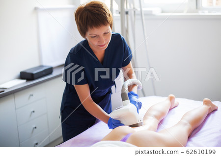 Skin care. Woman is in the process at the clinic lipomassage. Skin care. Woman is in the process at the clinic lipomassage. 62610199