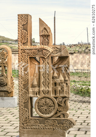 Stone cross carved with ornaments in the form of the seventh letter  of the Armenian alphabet, created by Mesrop Mashtots in the village of Oshakan 62610275
