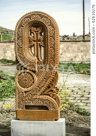 Stone cross carved with ornaments in the form of the sixth letter of the Armenian alphabet, created by Mesrop Mashtots in the village of Oshakan Stone cross carved with ornaments in the form of the sixth letter of the Armenian alphabet, created by Mesrop Mashtots in the village of Oshakan 62610276