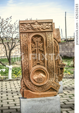 Stone cross carved with ornaments in the form of the first letter of the Armenian alphabet, created by Mesrop Mashtots in the village of Oshakan 62610283