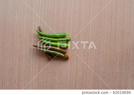fresh chili on a wooden floor 62618699
