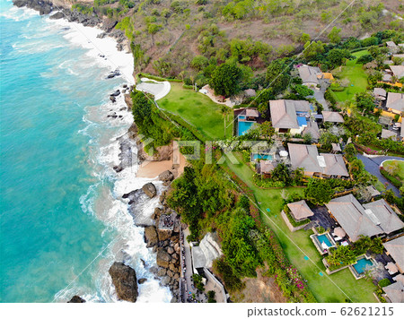 Aerial view of luxury hotel and private villa with swimming pool in the border of the cliff , Bali 62621215