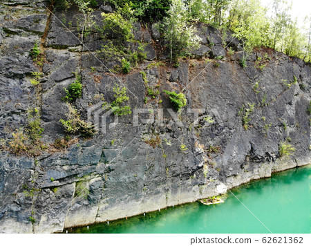 Aerial view of flooded quarry and dive site Aerial view of flooded quarry and dive site 62621362