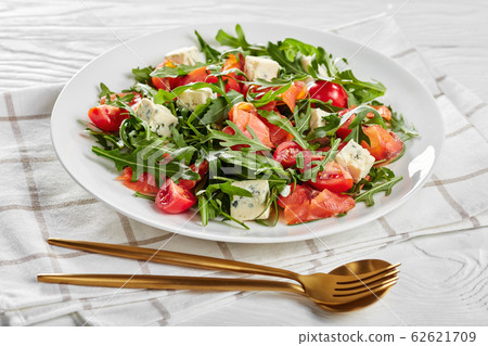 salmon arugula blue cheese salad, top view salmon arugula blue cheese salad, top view 62621709