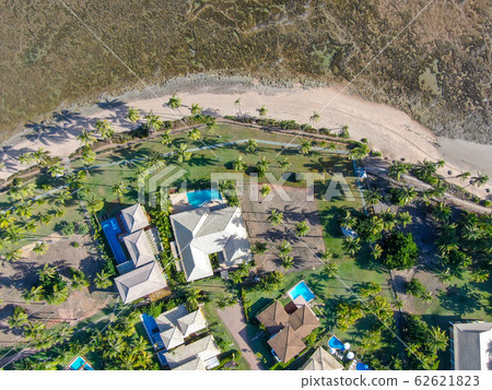 Aerial view of tropical white sand beach with tropical villas 62621823