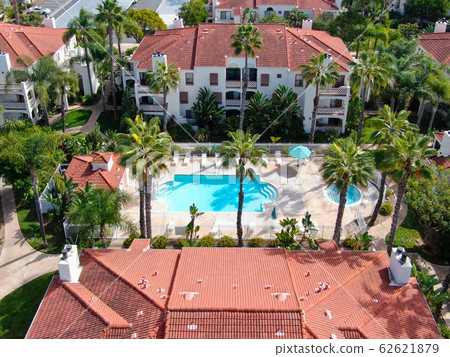 Aerial view of typical Southern California Spanish style residential condo with swimming pool 62621879