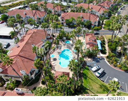 Aerial view of typical Southern California Spanish style residential condo with swimming pool 62621913