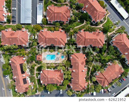 Aerial view of typical Southern California Spanish style residential condo with swimming pool 62621952