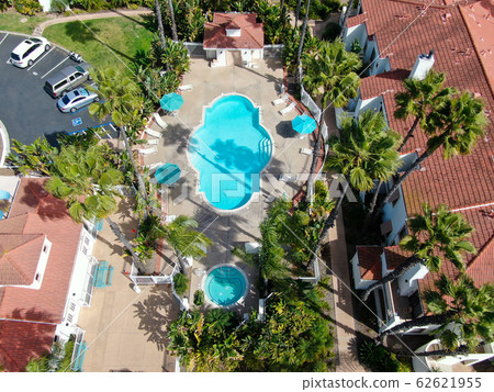 Aerial view of typical Southern California Spanish style residential condo with swimming pool 62621955