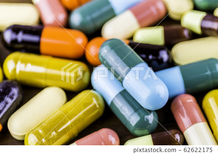 Drug prescription for treatment medication. Pharmaceutical medicament, cure in container for health. Pharmacy theme, capsule pills with medicine antibiotic in packages.closeup,Medicine or capsules. 62622175