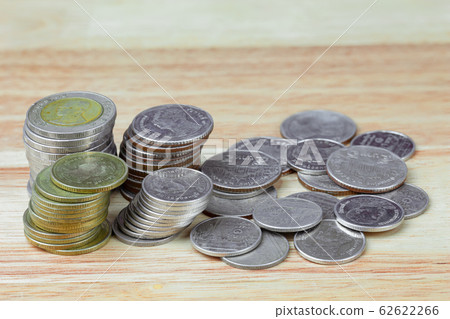 Thai baht coins on wood grain background 62622266