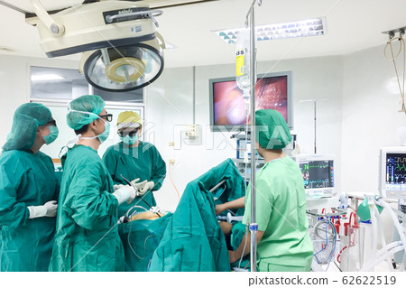 Doctor Team Performing Surgical Operation in Operating Room at hospital in East Asia, Thailand at 2 am on 11/05/2019. Doctor Team Performing Surgical Operation in Operating Room at hospital in East Asia, Thailand at 2 am on 11/05/2019. 62622519