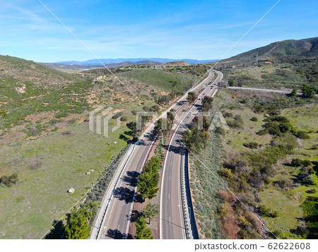 Curving road and downhill with houses in suburb of San Diego Curving road and downhill with houses in suburb of San Diego 62622608