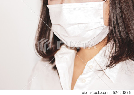 The mouth of a woman wearing a mask b warm color The mouth of a woman wearing a mask b warm color 62623856