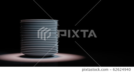 Heap of White Porcelain Dishes Spotlighted on Black Background 62624940