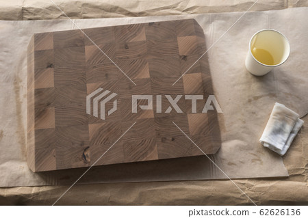applying food safe oil finish to walnut cutting board composition 62626136