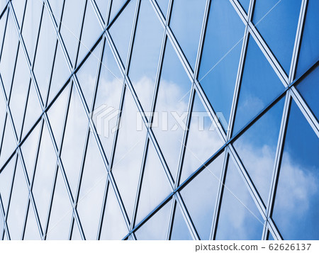 Architecture details Modern Building Glass facade reflection blue sky Architecture details Modern Building Glass facade reflection blue sky 62626137