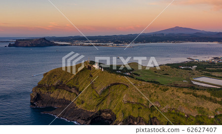 Aerial View of Udo Peak, Seongsan Ilchulbong Tuff Cone and Hallasan Mountain, Sunrise Time  62627407