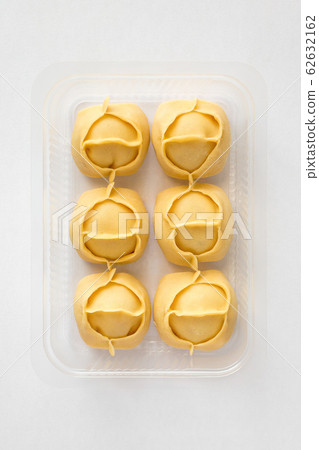 Big dumplings Manti in plastic container for sale. Big dumplings Manti in plastic container for sale. 62632162