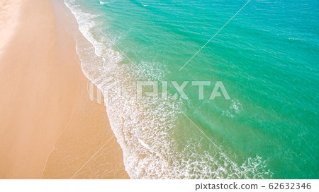 Top view aerial image from drone of an stunning beautiful sea landscape beach with turquoise water with copy space for your text.Beautiful Sand beach with turquoise water,aerial UAV drone shot Top view aerial image from drone of an stunning beautiful sea landscape beach with turquoise water with copy space for your text.Beautiful Sand beach with turquoise water,aerial UAV drone shot 62632346