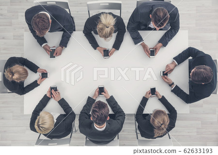 Business people using smartphones 62633193