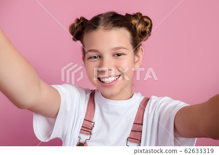 Close-up of young funny woman taking selfie Close-up of young funny woman taking selfie 62633319
