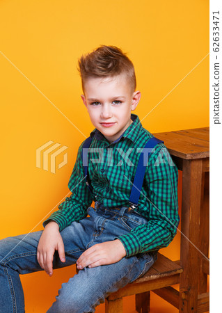 portrait of cute little kid boy in stylish jeans clothes looking at camera 62633471